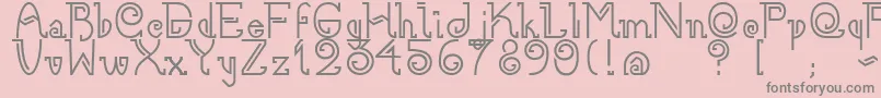 フォントNee – ピンクの背景に灰色の文字