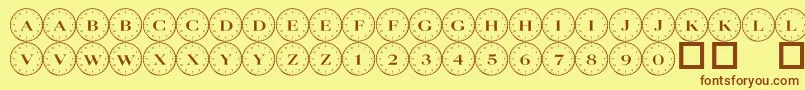 フォント101 Compass – 茶色の文字が黄色の背景にあります。