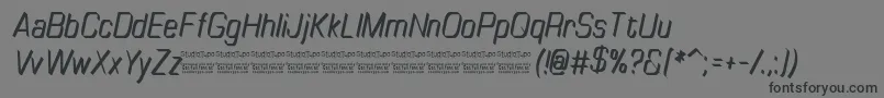 Шрифт TinyplateItalicDemo – чёрные шрифты на сером фоне