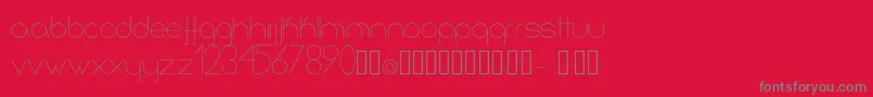Infinita-fontti – harmaat kirjasimet punaisella taustalla