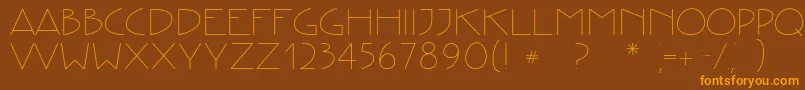 フォントCreativetypeRegular – オレンジ色の文字が茶色の背景にあります。