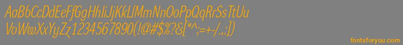 フォントDynagrotesklcItalic – オレンジの文字は灰色の背景にあります。