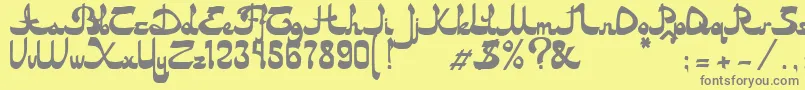 Asylbekm20dastan.Kz-fontti – harmaat kirjasimet keltaisella taustalla