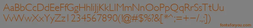 フォントGlsl – 茶色の文字が灰色の背景にあります。
