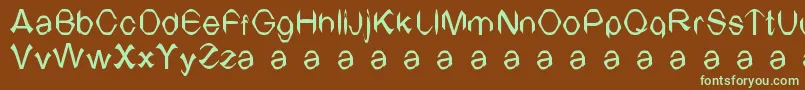 フォントTvArial – 緑色の文字が茶色の背景にあります。