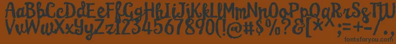 KarameliaDemo Font – Black Fonts on Brown Background