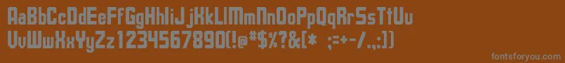 UpsilonCnBold Font – Gray Fonts on Brown Background