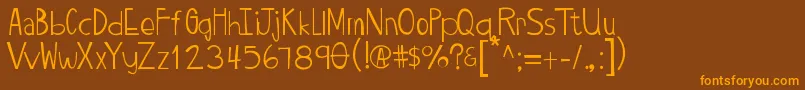 Twiggypop-Schriftart – Orangefarbene Schriften auf braunem Hintergrund