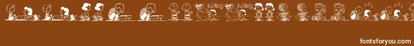 Czcionka PeanutsGangDingbats – białe czcionki na brązowym tle