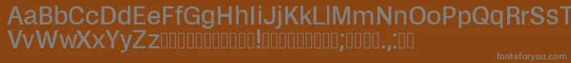 Zikketica-fontti – harmaat kirjasimet ruskealla taustalla