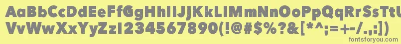 フォントHereJustNow – 黄色の背景に灰色の文字