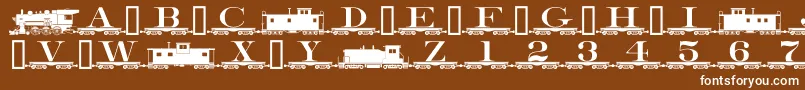 Czcionka Alphabettrain – białe czcionki na brązowym tle