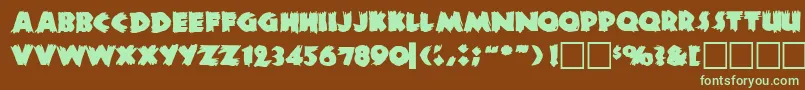 フォントZombiea – 緑色の文字が茶色の背景にあります。