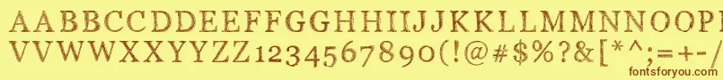 Pwserifscratch-Schriftart – Braune Schriften auf gelbem Hintergrund
