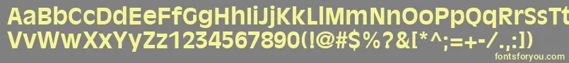 AntiqueOliveLtBold-fontti – keltaiset fontit harmaalla taustalla