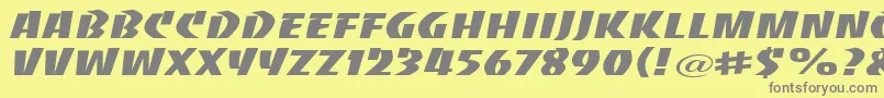 BaccaratwideRegular-fontti – harmaat kirjasimet keltaisella taustalla