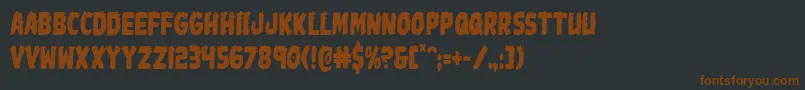 Johnnytorchcond-fontti – ruskeat fontit mustalla taustalla