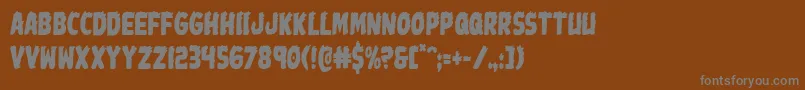 Johnnytorchcond Font – Gray Fonts on Brown Background