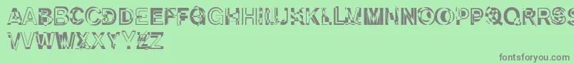 DekunstInitialen Font – Gray Fonts on Green Background