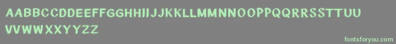 CfnationalstitchesRegular Font – Green Fonts on Gray Background