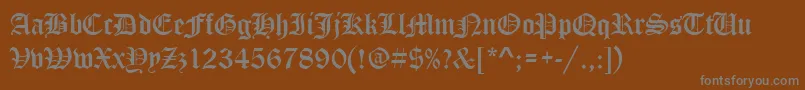 StOldEnglish-Schriftart – Graue Schriften auf braunem Hintergrund