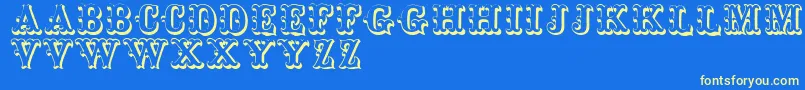 Toskanischeegyptienneinitialen Font – Yellow Fonts on Blue Background