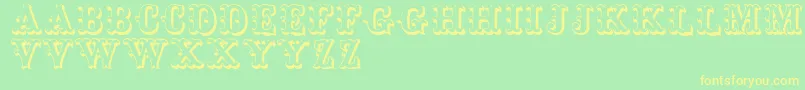 Toskanischeegyptienneinitialen Font – Yellow Fonts on Green Background