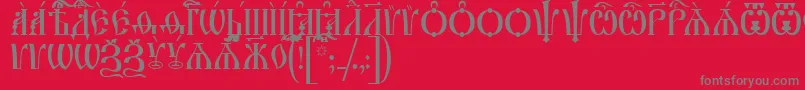フォントIrmologionCapsIeucs – 赤い背景に灰色の文字