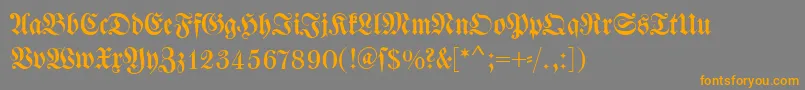 フォントDswalbaumfraktur – オレンジの文字は灰色の背景にあります。