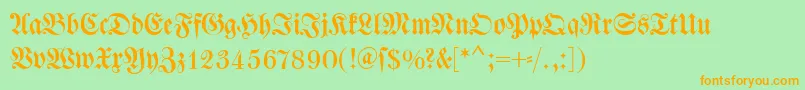 Dswalbaumfraktur-Schriftart – Orangefarbene Schriften auf grünem Hintergrund