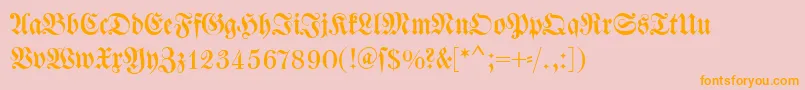 フォントDswalbaumfraktur – オレンジの文字がピンクの背景にあります。