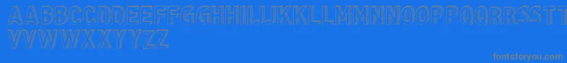 CfthreedimensionspersonalR-fontti – harmaat kirjasimet sinisellä taustalla