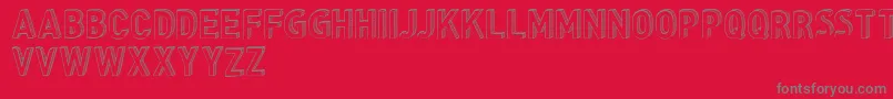 CfthreedimensionspersonalR-fontti – harmaat kirjasimet punaisella taustalla