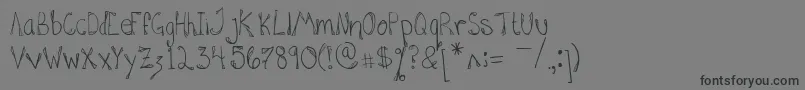 HannahAddedSomeFlare Font – Black Fonts on Gray Background