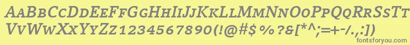 フォントCompatilLetterLtComBoldItalicSmallCaps – 黄色の背景に灰色の文字