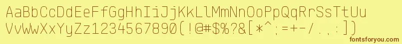 フォントKlartextMonoThin – 茶色の文字が黄色の背景にあります。