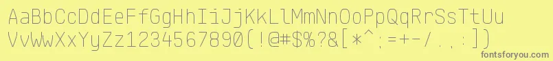 フォントKlartextMonoThin – 黄色の背景に灰色の文字