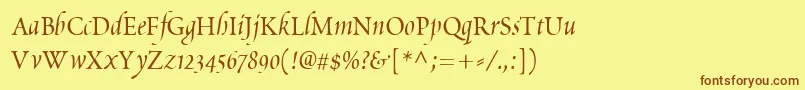 フォントPoeticaChanceryIv – 茶色の文字が黄色の背景にあります。