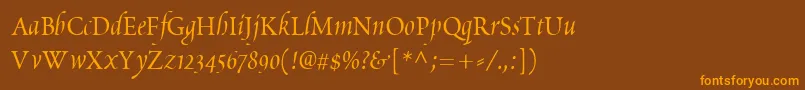 フォントPoeticaChanceryIv – オレンジ色の文字が茶色の背景にあります。