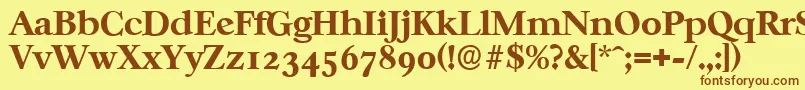 フォントCasablancaserialXboldRegular – 茶色の文字が黄色の背景にあります。