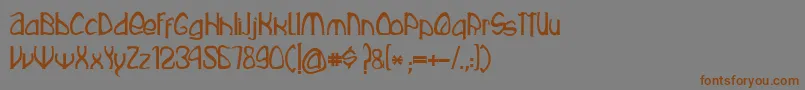 フォントRustika – 茶色の文字が灰色の背景にあります。