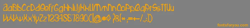 フォントRustika – オレンジの文字は灰色の背景にあります。