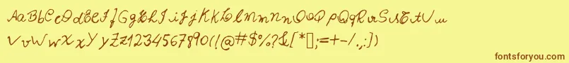 フォントIzabela – 茶色の文字が黄色の背景にあります。