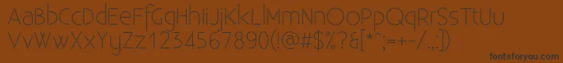 ExistenceStencillight Font – Black Fonts on Brown Background