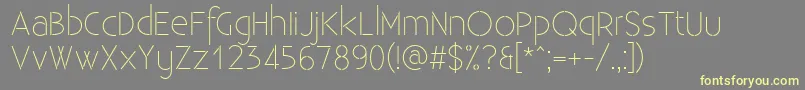 ExistenceStencillight-fontti – keltaiset fontit harmaalla taustalla