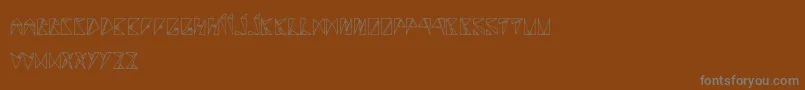 RancuneTriangulaire-Schriftart – Graue Schriften auf braunem Hintergrund
