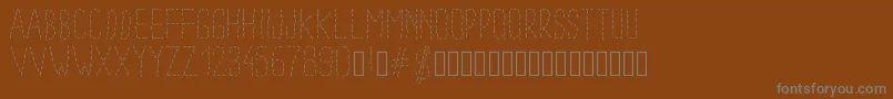 Шрифт Pwdottedfont – серые шрифты на коричневом фоне