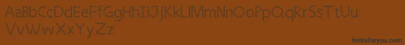 Saiba mais sobre a fonte Strongleaf Fonte Strongleaf – fontes pretas em um fundo marrom