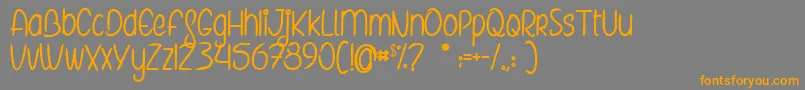 TheElvesAndTheSecretGarden Font – Orange Fonts on Gray Background