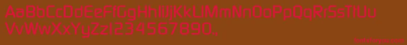 フォントTqfPcmedium – 赤い文字が茶色の背景にあります。